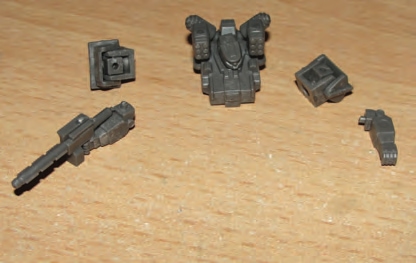 Glue head/v-engine/MRPs to torso. Clip off gun handle & glue gun to hand/arm in desired pose.