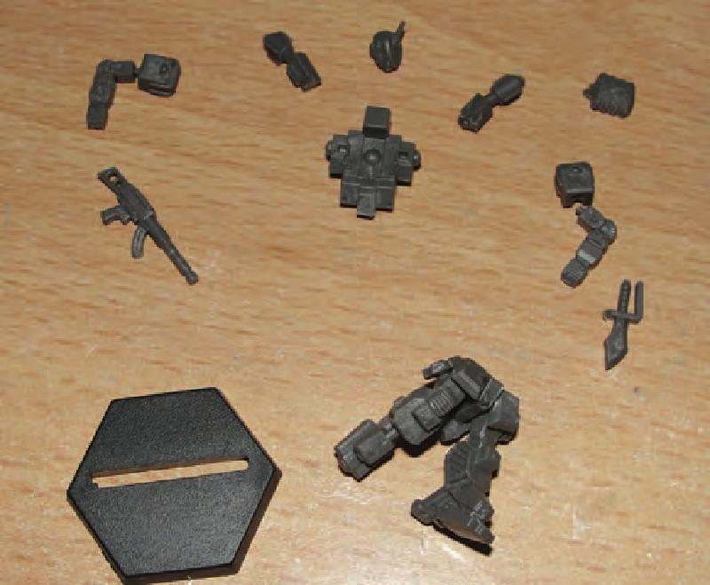 Clip & clean all the parts. Then glue the legs & butt plate to hips in desired pose. Then glue the hip armor plates to legs and hips.