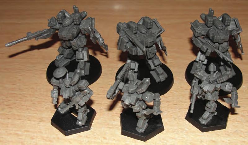 Hip armor plates glued on legs/hips and then ammo box and small box glues between side armor plates and butt plate to fill in gaps. Torso, head and arm parts prepared for final gluing.